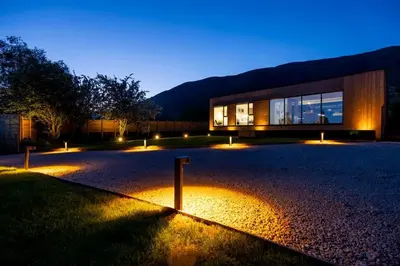 a building with lights in front of it at night at Retreat to the Campsies in Lennoxtown