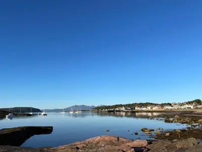 a view of a body of water with rocks at Kames Bay Couples Retreat in Millport