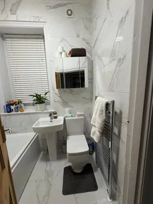 a bathroom with a toilet and a sink and a tub at Cosy Double Bedroom in Little Venice, Maide Vale in Moffat