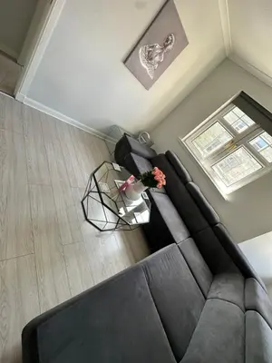 an overhead view of a living room with a couch and a table at Old Town Place in Edinburgh