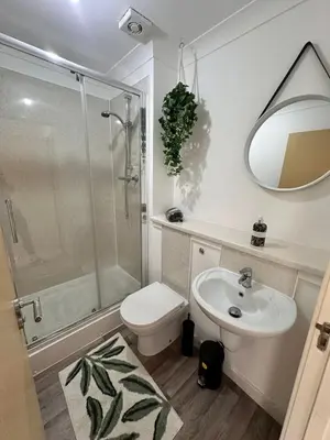 a bathroom with a toilet and a sink and a shower at 2BR Flat Free Parking Near Hampden and O2 Academy in Glasgow