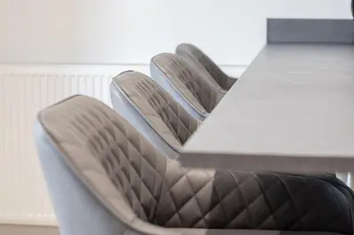 two chairs sitting next to a table with a table at Alexandra Apartment - Single Room #1 in Falkirk