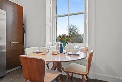 a dining room with a table and chairs and a window at Merchiston 1 Room in Shared Apartment with Parking - Edinburgh in Edinburgh