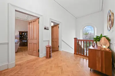 a living room with a wooden floor and a hallway at Merchiston 1 Room in Shared Apartment with Parking - Edinburgh in Edinburgh