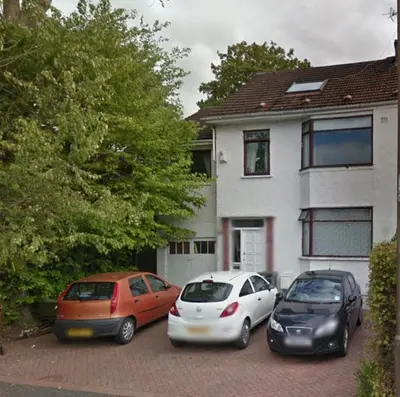 three cars parked in a parking lot in front of a house at Silverknowes in Edinburgh