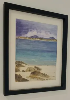 a framed painting of a beach and the ocean at Thistle & Tide in Edinburgh