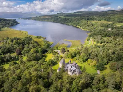 an aerial view of a house next to a lake at The South Wing in Acharn
