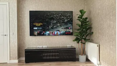a living room with a tv on the wall at Entire Spacious 3-Bed Family Home, City Centre, Free Parking, Garden in Glasgow