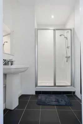 a bathroom with a shower and a sink at GuestReady - Modern 1BR in Edinburgh in Edinburgh