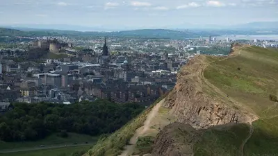 a view of a city from the top of a hill at Edinburgh Drumdryan Central Apart in Edinburgh