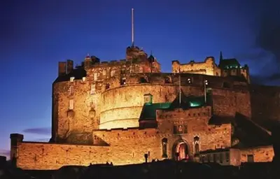 a large castle is lit up at night at Edinburgh Drumdryan Central Apart in Edinburgh