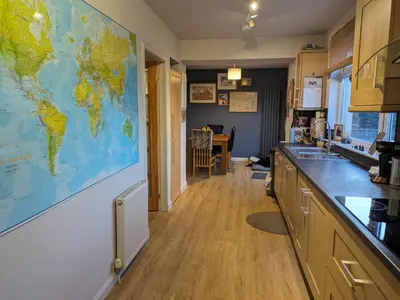 a kitchen with a large map on the wall at Edinburgh Home from Home in Edinburgh