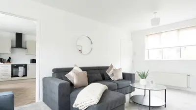 a living room with a couch and a table at Craigseaton House in Broxburn