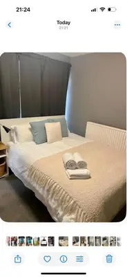 a bedroom with a bed with two towels on it at Bank West in Edinburgh