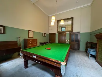 a large room with a pool table in it at The Billiard Room Flat