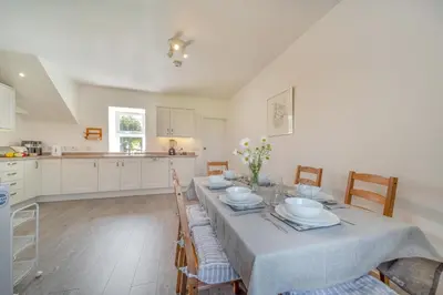 a kitchen and dining room with a table and chairs at 3 Bed in Clachan oc-h32242 in Clachan