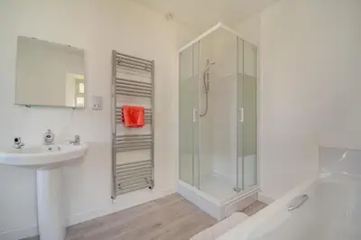 a white bathroom with a shower and a sink at 3 Bed in Clachan oc-h32242 in Clachan