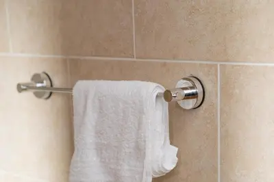 a towel hanging on a towel rack in a bathroom at Clydebank 2 Bedroom Home in Drumchapel
