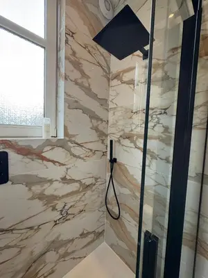 a shower in a bathroom with a marble wall at Spacious 2 Bed Edinburgh - Perfect Location in Edinburgh
