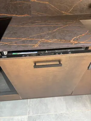 an open laptop computer sitting on top of a counter at Spacious 2 Bed Edinburgh - Perfect Location in Edinburgh