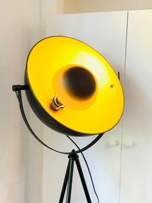 a yellow hat sitting on top of a stand at Cosy City Centre Apartment in Edinburgh