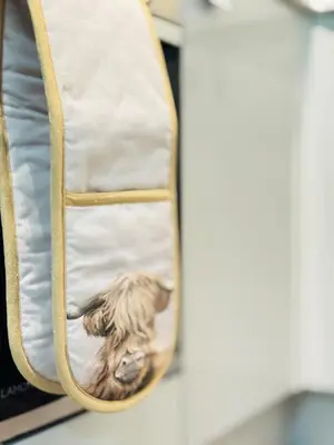 a bag with a picture of a dog inside at Cosy City Centre Apartment in Edinburgh