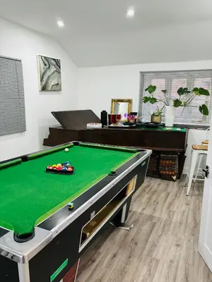 a living room with a pool table in a room at Hertford detached home garden pet friendly parking in Moffat