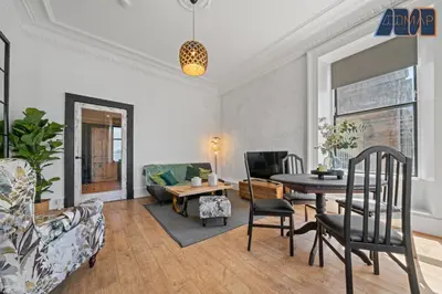 a living room with a table and a couch at Modern 2 Bed Sleep 4 In Gourock in Gourock