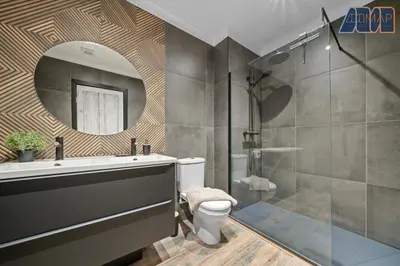 a bathroom with a shower and a toilet and a mirror at Modern 2 Bed Sleep 4 In Gourock in Gourock