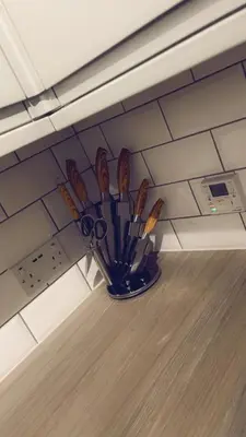 a group of scissors sitting on a shelf in a room at Casa da Paz in Glasgow