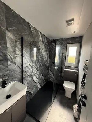 a bathroom with a toilet and a sink at Home Comfort Prestwick in Prestwick