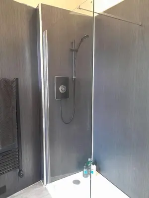 a shower with a glass door in a bathroom at Outlander 4 Apartment Doune in Stirling