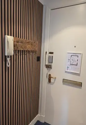 a room with a door with a sign that reads escape at Peaceful Edinburgh Retreat - Quiet Central 1-Bed in Edinburgh