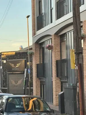 a car parked in front of a building at Stylish Flat in City Center in Moffat