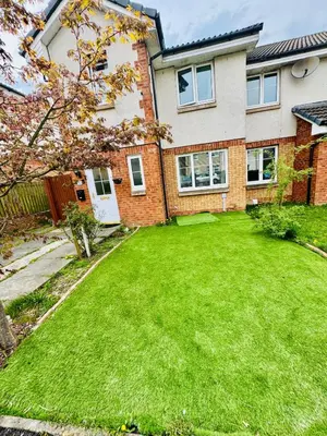 a house with a green lawn in front of it at Glasgow 3 bed Guest House in Glasgow
