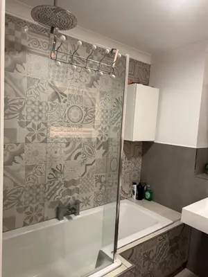 a bathroom with a shower with a glass door at Glasgow 3 bed Guest House in Glasgow