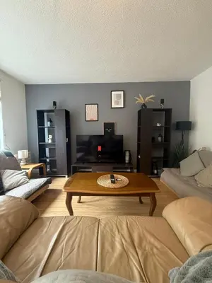 a living room with a coffee table and a couch at City Centre 2 Bed Apartment in Glasgow