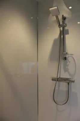 a bathroom with a shower with a shower head at Fortingall Cottage - Dalmally in Dalmally
