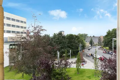 a view of a street in a city with a building at Townhead Apartments Glasgow Airport in Paisley