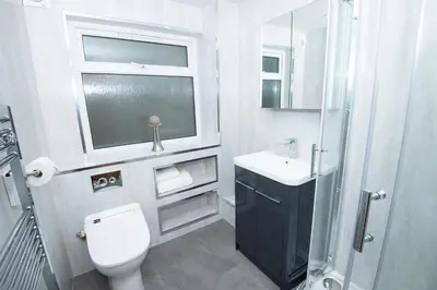 a bathroom with a toilet and a sink and a shower at Private Home North of Dunblane in Braco