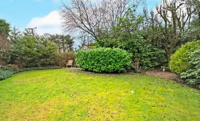 a yard with a large green yard with trees at Private Home North of Dunblane in Braco