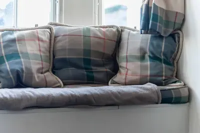 a couple of pillows sitting on a window sill at Edinburgh City Retreat - EDINBURGH CITY CENTRE 3 min walk to Edinburgh castle in Edinburgh