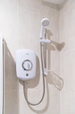 a shower with a shower head in a bathroom at Edinburgh City Retreat - EDINBURGH CITY CENTRE 3 min walk to Edinburgh castle in Edinburgh
