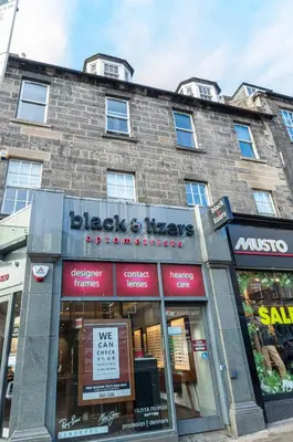 a store front of a brick building at Edinburgh City Retreat - EDINBURGH CITY CENTRE 3 min walk to Edinburgh castle in Edinburgh