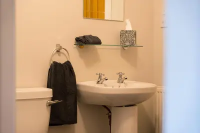 a bathroom with a sink and a toilet at Tigh Na Cille Studio in Taynuilt