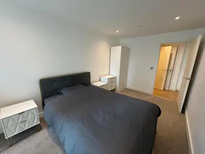 a bedroom with a large bed and two night stands at victoria resedent in Moffat