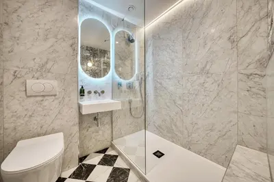 a bathroom with a shower and a toilet and a sink at City Oasis Craigpark Residence in Glasgow