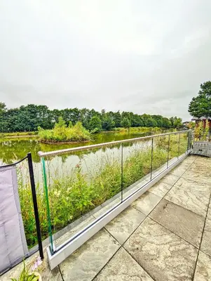a walkway over a river with a view at Lakeside Lodge - Lakeside Lodge Retreat - Golf & Spa, Gleneagles in Dunning