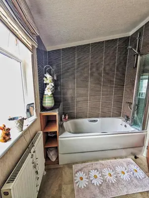 a bathroom with a white tub in a room at Lakeside Lodge Retreat, with Roof Deck - Golf & Spa, Gleneagles