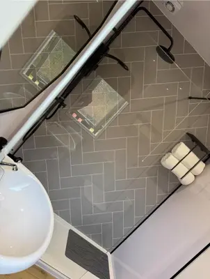 a bathroom with a sink and a toilet at Hunters Quay - Hot Tub Lodge at Limecroft 6 in Hunters Quay